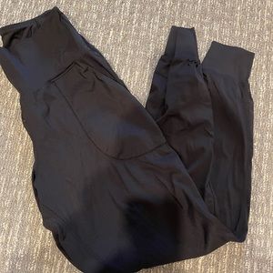 Black spandex material joggers with pockets. Size S